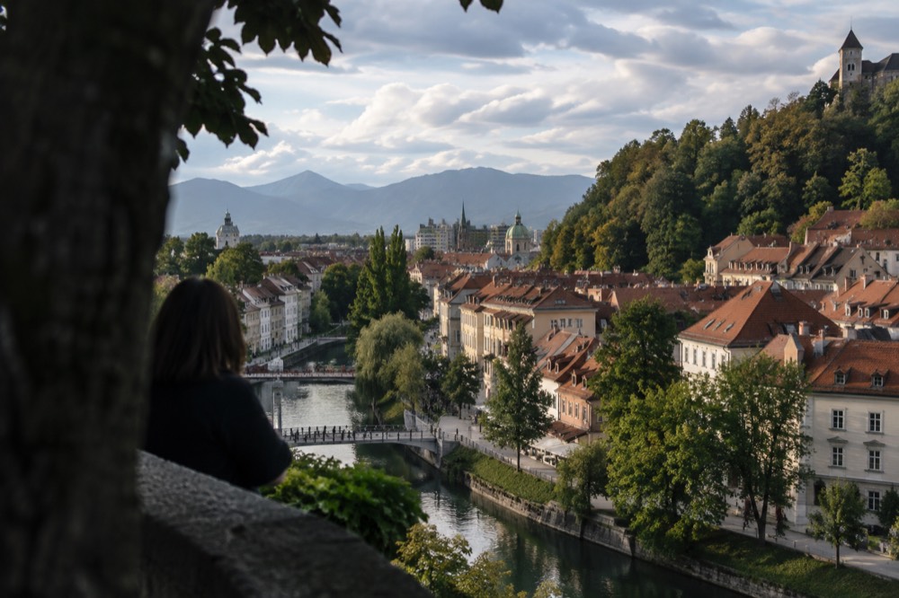 The Ljubljanica river and the old town rooftops of Ljubljana seen from the castle hill