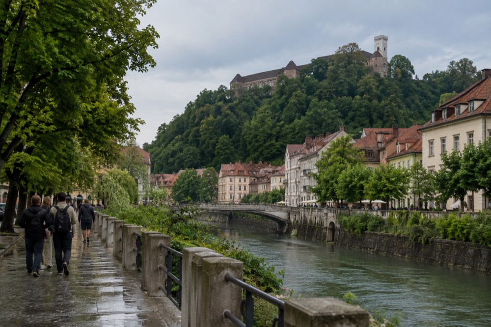 Ljubljana's riverside old town with the castle hill rising above the rooftops