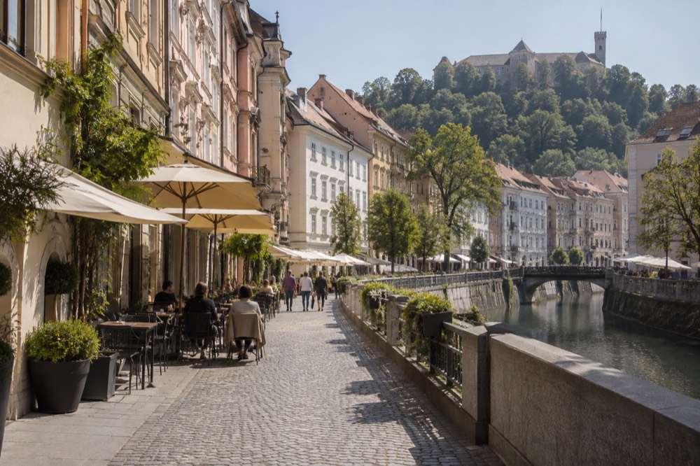 Café tables and pastel facades along the pedestrianised streets of central Ljubljana