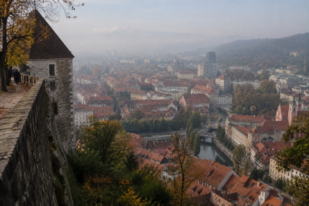 Autumn mist over the red rooftops of Ljubljana old town from the castle ramparts