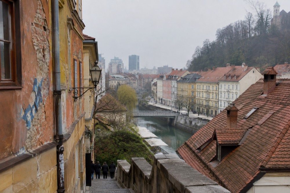 Colourful painted facades and paint-covered walls in an alternative courtyard in Ljubljana