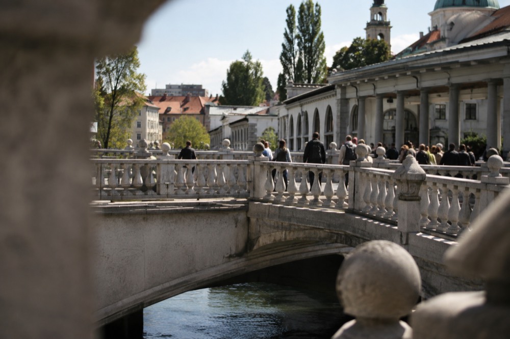 The Triple Bridge crossing the Ljubljanica in central Ljubljana with the market colonnade alongside