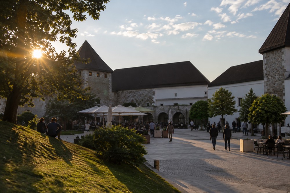 The castle courtyard with its towers and café terraces under an open sky