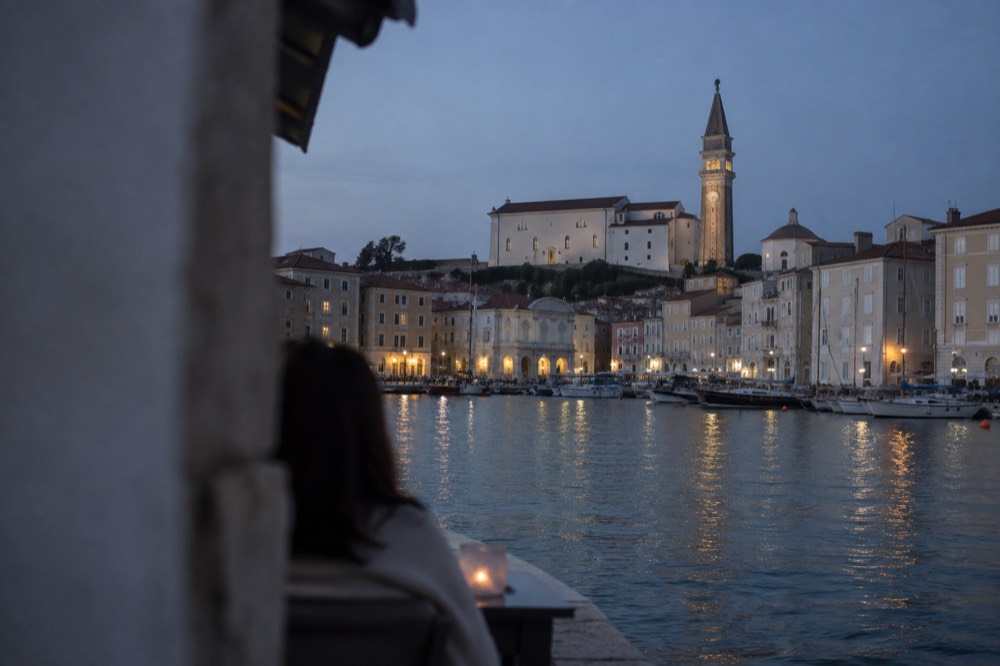 The walled old town of Piran seen across its small harbour