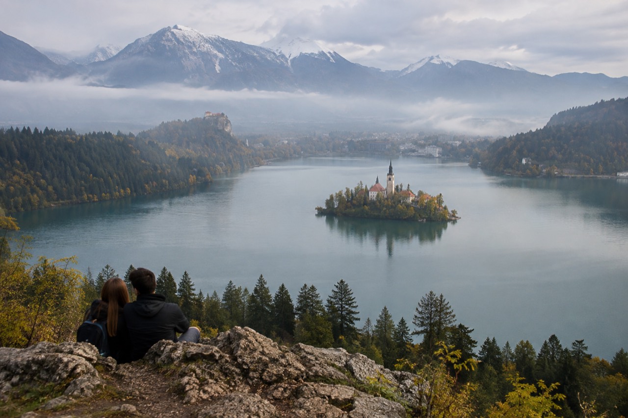 Lake Bled with the island church and wooded shore on a calm morning