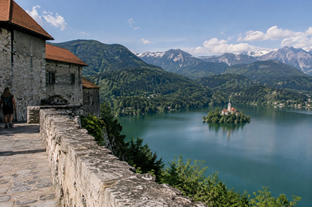 Bled Castle stone walls above the lake with the island in the distance