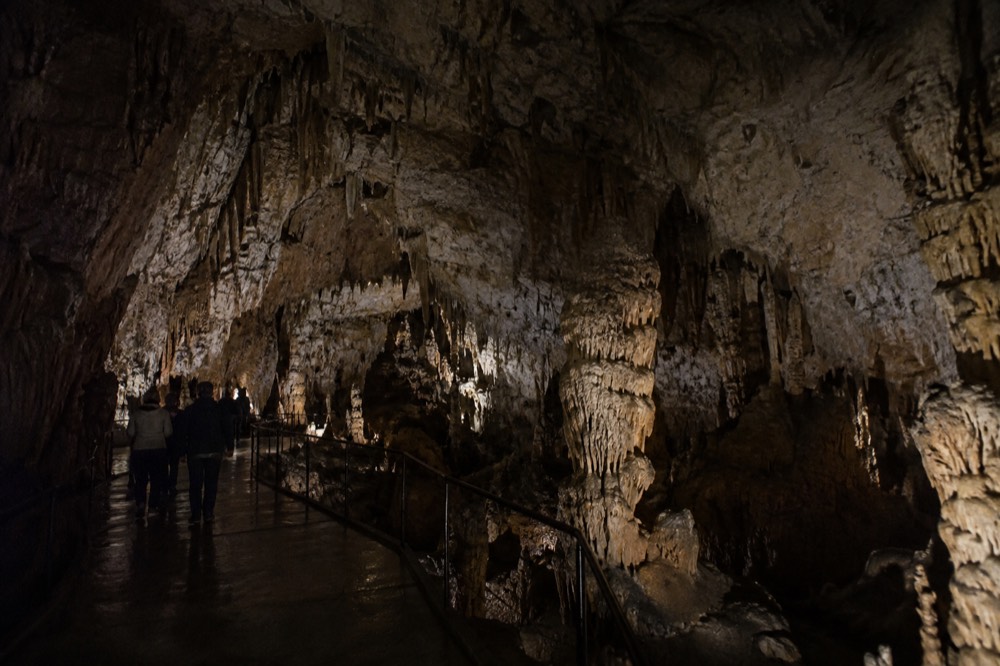 Karst landscape with limestone hills and a country road in south-west Slovenia