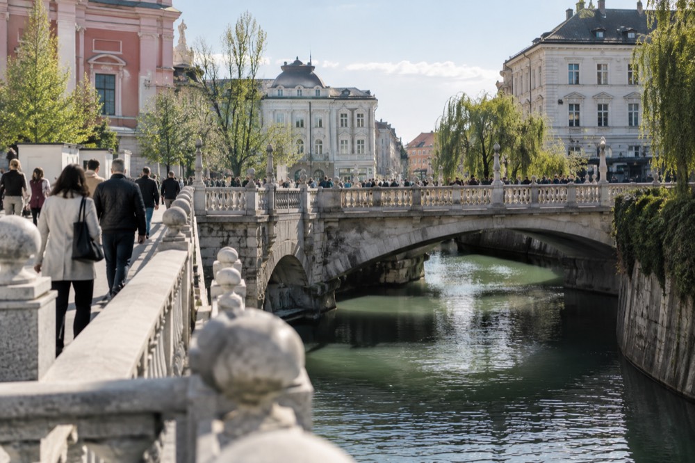 The Ljubljanica river and the Triple Bridge in Ljubljana on a bright morning