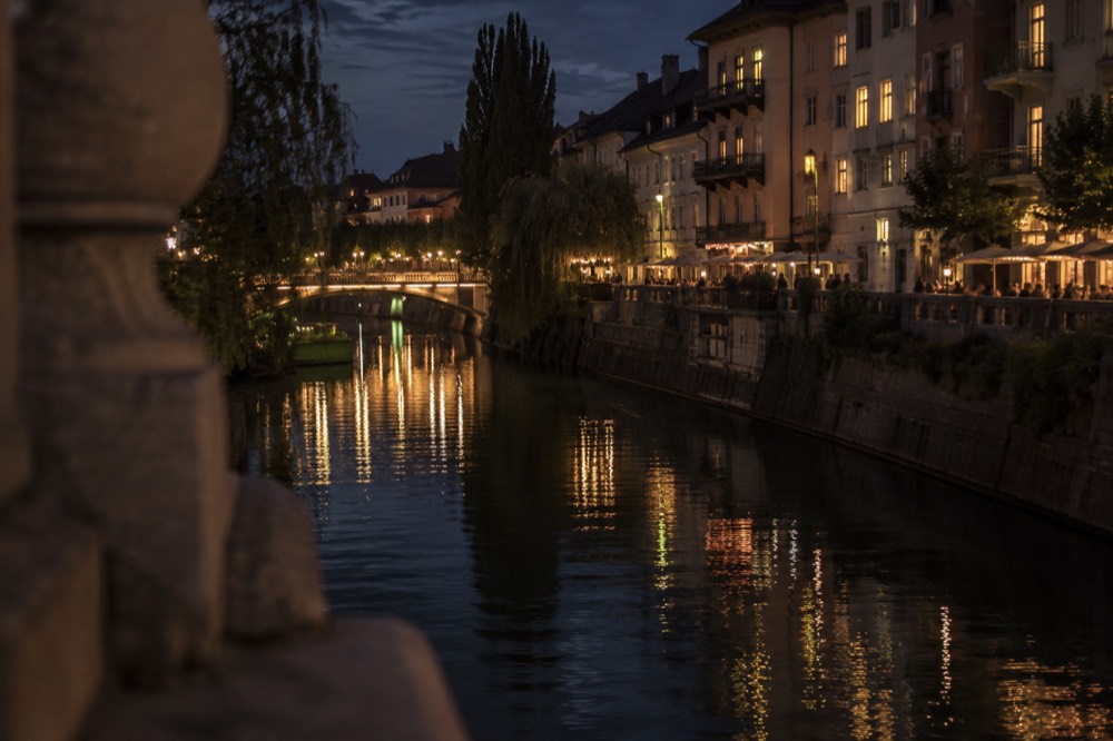 Evening reflections of riverside buildings in the Ljubljanica river