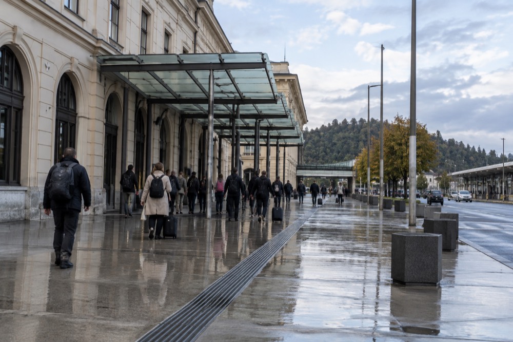The station forecourt of Ljubljana Train Station with the glass canopy over the entrance