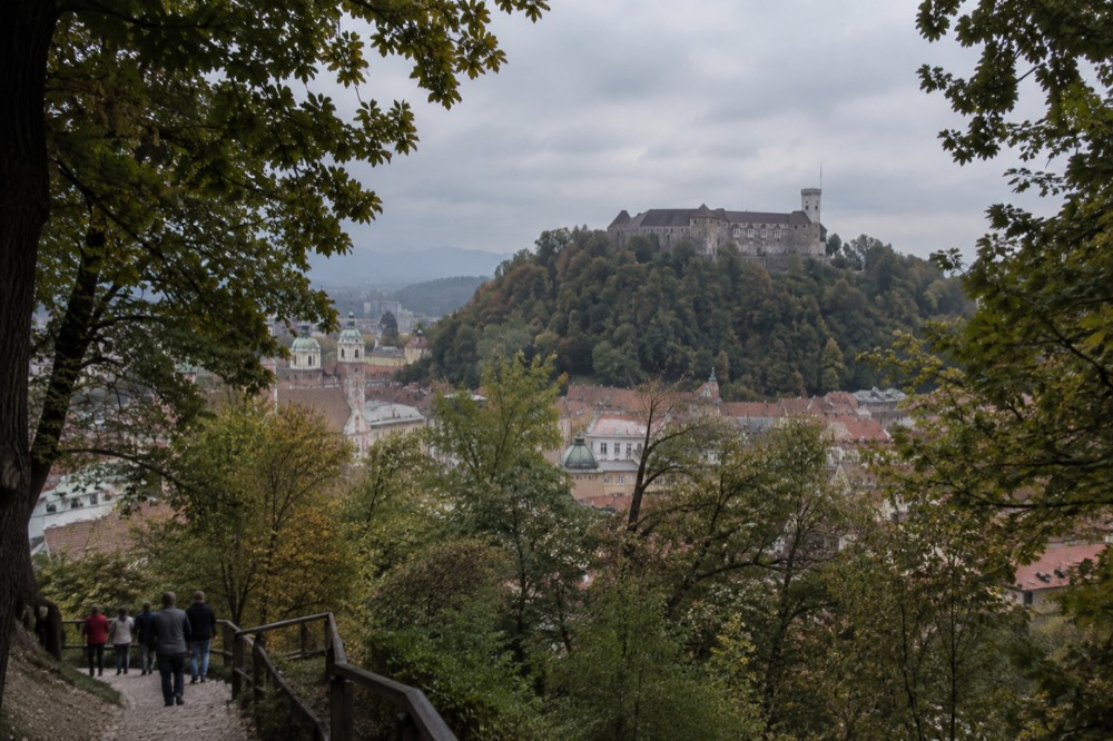 Ljubljana Castle walls and tower seen from the wooded hillside below