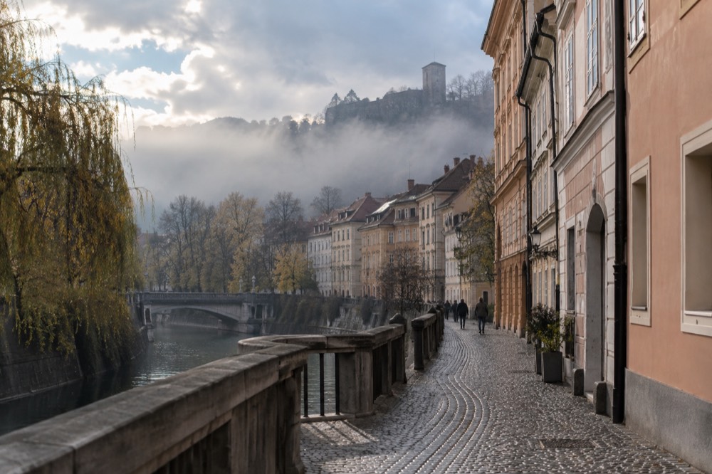 Morning fog sitting over the Ljubljana basin with hilltops above the mist layer