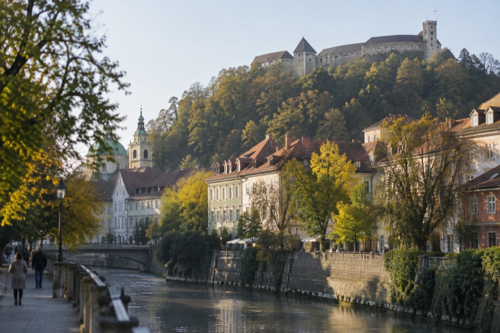 Ljubljana's riverside old town with the castle hill rising behind the rooftops