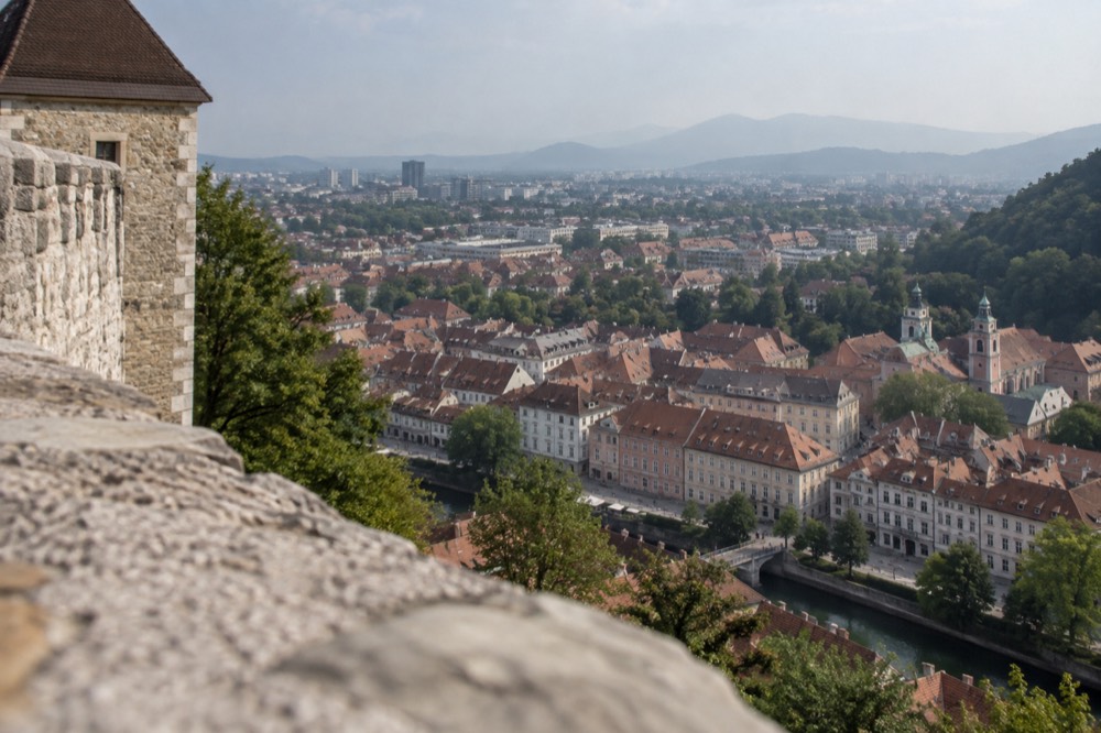 Ljubljana old town rooftops seen from the castle tower on a clear morning