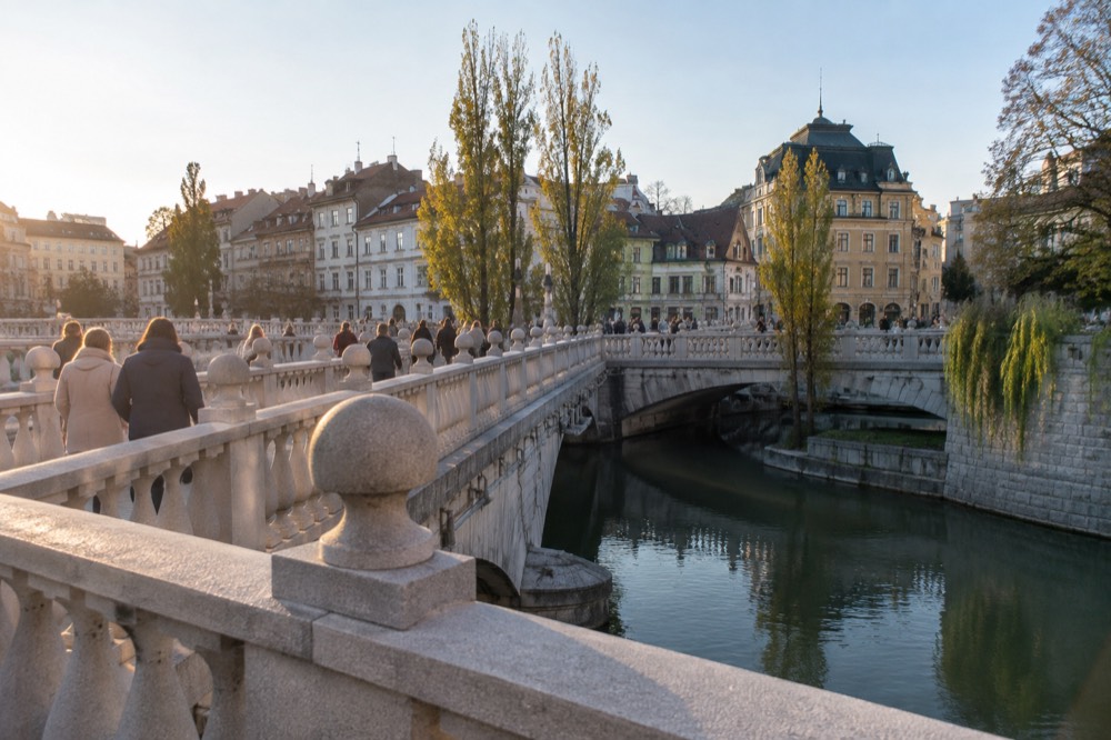 The Triple Bridge and the Ljubljanica river embankment on a calm afternoon