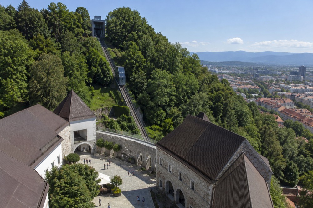 The funicular railway climbing the wooded castle hill above the old town